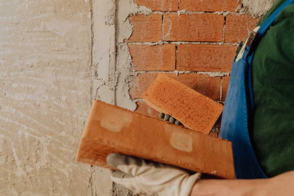 person holding bricks